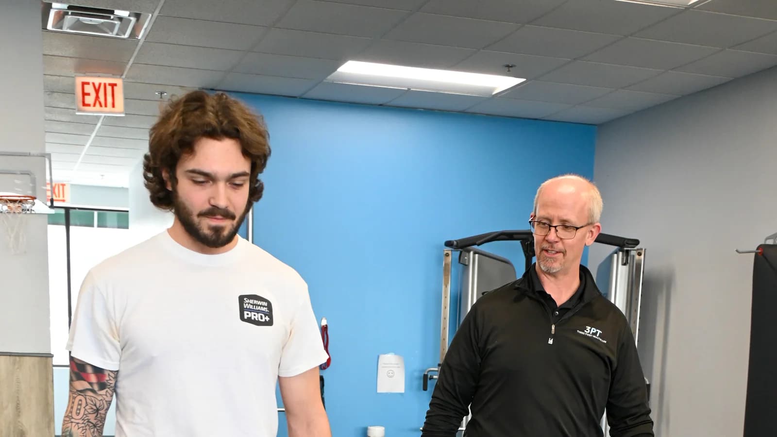 A 3PT Elmhurst physical therapist performing hands-on postural manual therapy on a patient at the clinic.