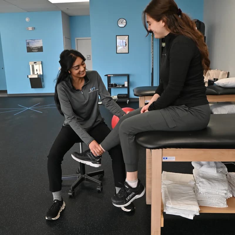 A 3PT Melrose Park physical therapist working with a patient during a treatment session.