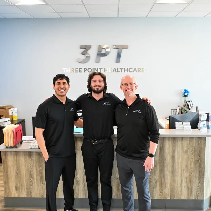 The 3PT Oak Lawn physical therapy team inside the clinic reception area.
